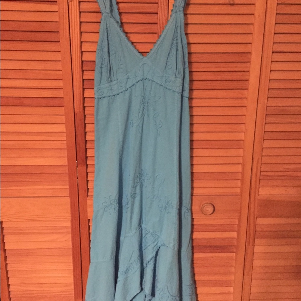 Mid thigh length dress as it comes up in front.